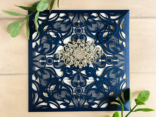 Invitation lc21: Glittering Navy, Cream Smooth, Brooch/Buckle A11, Metal Filigree F4 - Silver - This is a four flap glittering navy laser cut wedding card.  There is a combo brooch on the flap.