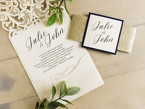 Invitation lc25: This is a pocket style laser cut wedding invitation in the ivory shimmer color.  There is a champagne glitter band with a white gold backing on the cover tag.