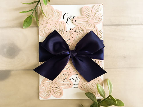 Invitation lc27: Pink Shimmer, Cream Smooth, Navy Ribbon - This is a pink shimmer floral pattern laser cut wedding card.  There is a large 1.5 inch navy bow tied around the card.