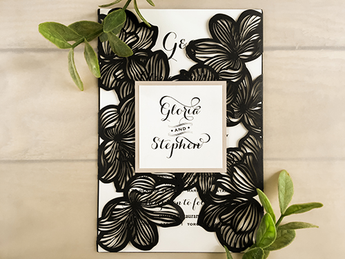 Invitation lc29: Glittering Black, Blush Pearl, Cream Smooth - This is a glittering black laser cut wedding card.  The gate flaps looks like florals. There is a blush pearl layered cover tag.