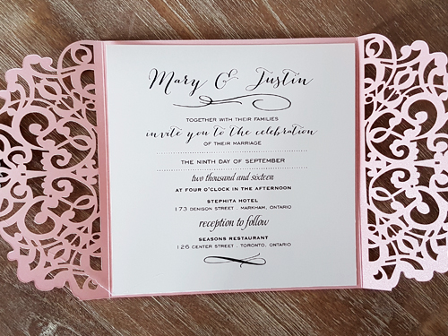 Invitation lc35: Pink Shimmer, Cream Smooth, Brooch/Buckle X - This is a pink shimmer pattern laser cut wedding invitation.  There is a rhinestone brooch glued in the center.
