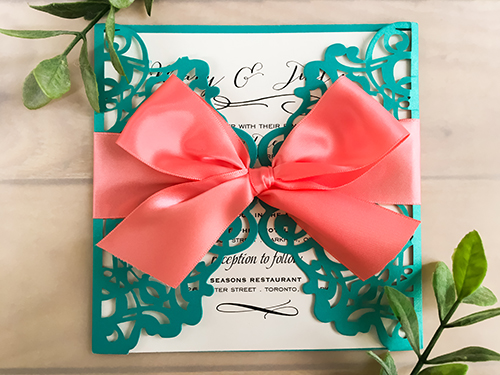 Invitation lc38: Tiffany Shimmer, Cream Smooth, Coral Ribbon - This is a tiffany shimmer gate fold laser cut wedding invite with a big coral ribbon bow.