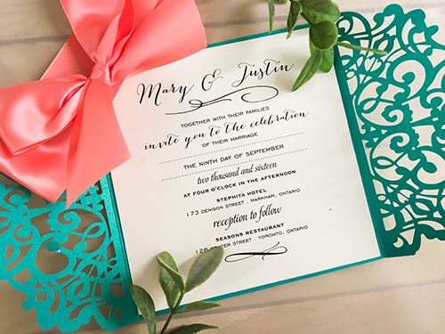 Invitation lc38: Tiffany Shimmer, Cream Smooth, Coral Ribbon - This is a tiffany shimmer gate fold laser cut wedding invite with a big coral ribbon bow.
