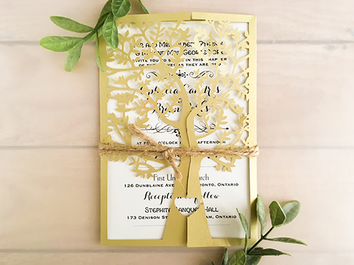 Invitation lc39: Metallic Gold, Cream Smooth - This is the metallic gold laser cut wedding invite.  The pattern is a tree design.  There is a rustic twine tied around the card.