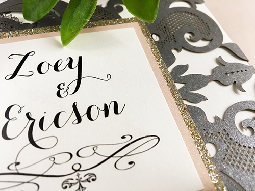 Invitation lc43: Grey Shimmer, Blush Pearl, Cream Smooth - This is a grey shimmer laser cut gate fold wedding invitation.  There is a double layer cover tag that uses the blush pearl and champagne glitter.