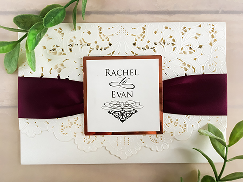 Invitation lc48: Ivory Shimmer, Rose Gold Mirror, Cream Smooth, Eggplant Ribbon - This is an ivory shimmer pocket style laser cut wedding invite.  There is a eggplant ribbon with rose gold mirror cover tag.