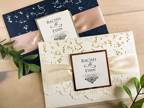 Invitation lc48: Ivory Shimmer, Rose Gold Mirror, Cream Smooth, Eggplant Ribbon - This is an ivory shimmer pocket style laser cut wedding invite.  There is a eggplant ribbon with rose gold mirror cover tag.