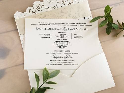 Invitation lc52: White, Cream Smooth, Antique Ribbon, Brooch/Buckle X - This is a pocket style laser cut wedding invitation in the white color.  There is an antique ribbon with rhinestone brooch on the flap.