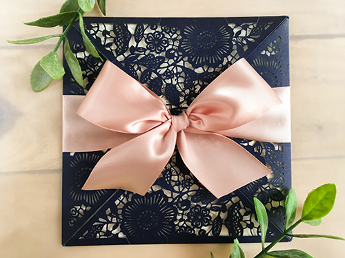 Invitation lc56: Glittering Navy, Cream Smooth, Deep Blush Ribbon - This is a square four flap laser cut wedding invitation in the glittering navy paper.  There is a deep blush bow.