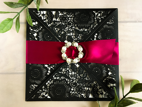 Invitation lc59: Glittering Black, Wine Ribbon, Brooch/Buckle W - This is a four flap glittering black laser cut wedding design card.  There is a wine ribbon woven into the pearl brooch.