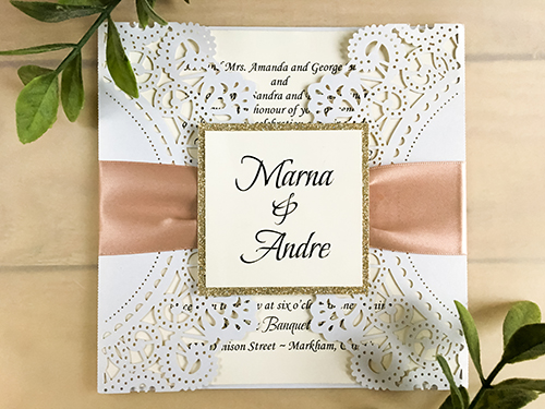 Invitation lc60: White Shimmer, Champagne Glitter, Cream Smooth, Deep Blush Ribbon - This is a white shimmer laser cut gate fold wedding invitation.  There is a champagne glitter layered cover tag with deep blush ribbon.