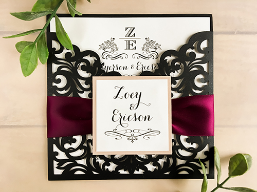 Invitation lc61: Glitter Black, Blush Pearl, Cream Smooth, Wine Ribbon - This is a pocket style laser cut wedding invite in the glitter black paper.  There is a wine ribbon and blush pearl layered cover tag.