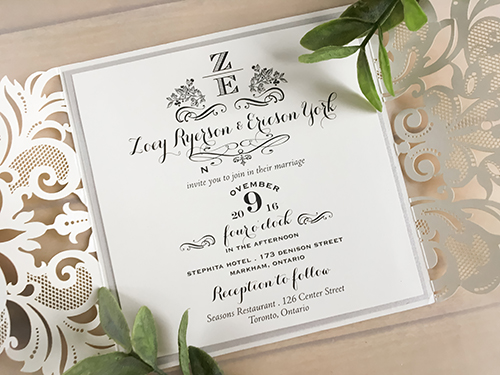 Invitation lc66: This is an ivory shimmer gate fold laser cut wedding invitation.  The cover tag has a silver ore backing.  The main layout has an extra silver ore layer.