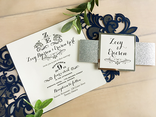 Invitation lc7: Baroque inspired laser cut wedding invitation in a deep glittering navy, with glitter wrap around belly band and a cover tag, backed with mirror paper.