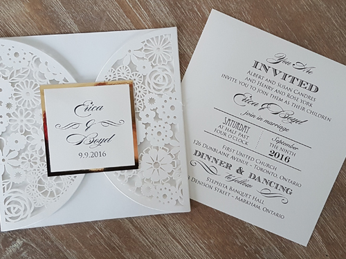 Invitation lc80: Ivory Shimmer, Gold Mirror, Cream Smooth - This is an ivory shimmer laser cut wedding invite.  The pattern has a lot of shapes.  There is a gold mirror layered cover tag on the flap.