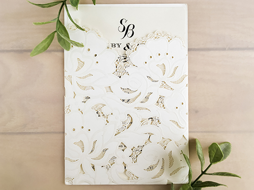 Invitation lc85: White, Cream Smooth - This is a pocket style laser cut wedding invite.  The pattern is an embossed look.  The insert is loose.