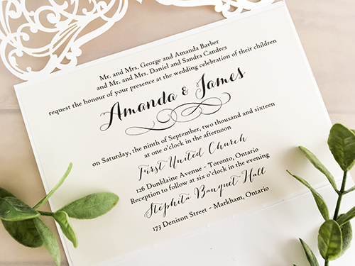 Invitation lc90: Ivory Shimmer - This is a simple ivory shimmer laser cut wedding invitation.  There is a rhinestone jewel on the cover.