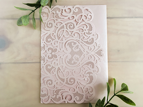 Invitation lc94: Blush Shimmer, Cream Smooth - This is a blush shimmer laser cut invitation with a heart design on the cover flap.  Classic style layout is glued to the middle.