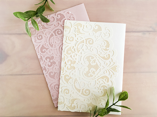 Invitation lc94: Blush Shimmer, Cream Smooth - This is a blush shimmer laser cut invitation with a heart design on the cover flap.  Classic style layout is glued to the middle.
