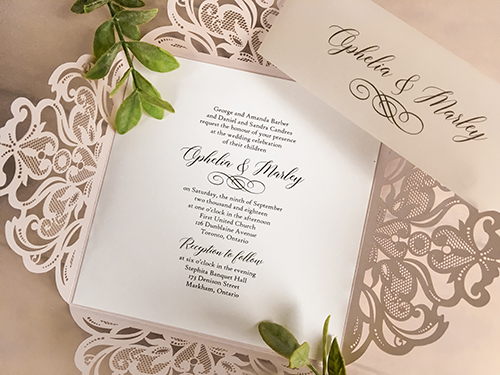 Invitation lc97: Blush Shimmer, White Smooth - This is a four flap laser cut wedding invitation in the blush shimmer color.  There is a vellum belly band wrapped around.