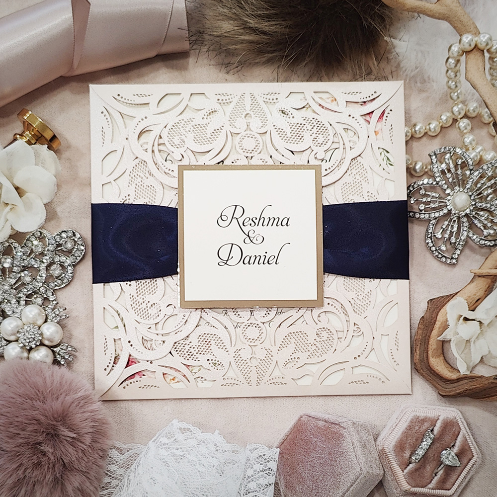 Invitation 8000: Ivory Shimmer, Gold Mirror, Cream Smooth, Navy Ribbon - 4 flap laser cut with ribbon and tag
