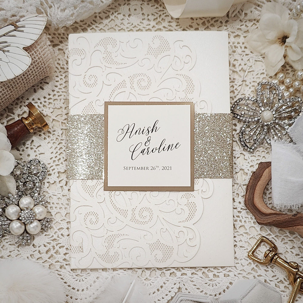 Invitation 8015: Ivory Shimmer, Gold Mirror, Cream Smooth - ivory lasercut with glitter band and tag and layered layout