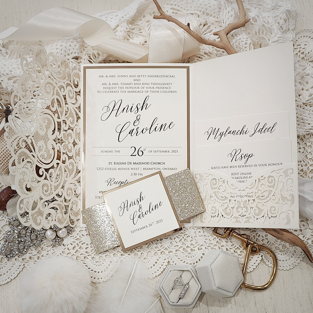 Invitation 8015: Ivory Shimmer, Gold Mirror, Cream Smooth - ivory lasercut with glitter band and tag and layered layout