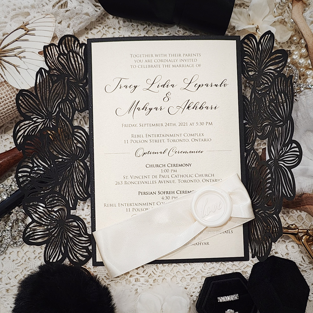 Invitation 8016: Glittering Black, Cream Smooth, Ivory Wax, Antique Ribbon - Black gate style lasercut with ribbon and wax seal