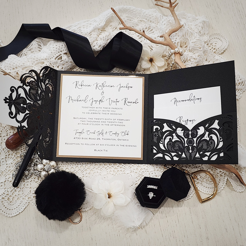 Invitation 8017: Glittering Black, Gold Mirror, White Smooth, White Ribbon - Black pocketfold lasercut with layered tag