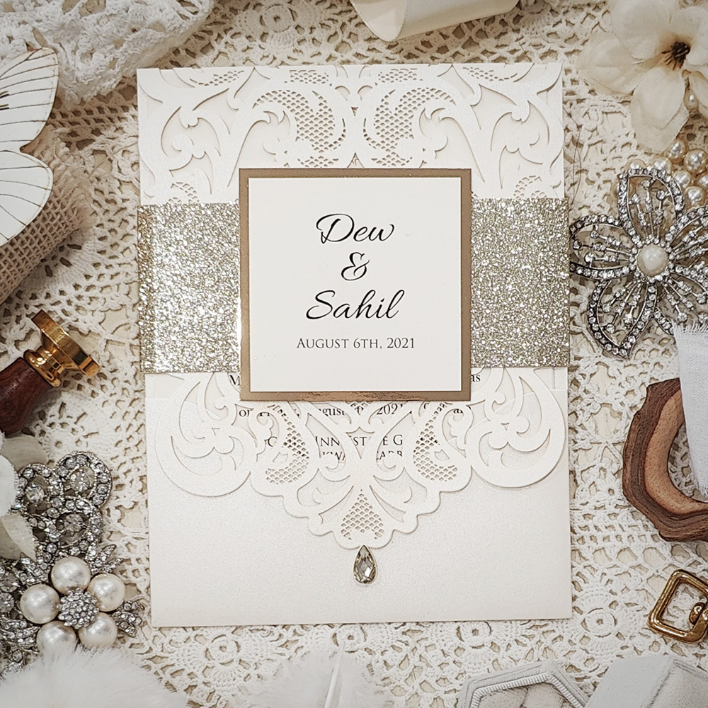 Invitation 8022: Ivory Shimmer, Gold Mirror, Cream Smooth - Ivory lasercut with glitter band and layered tag