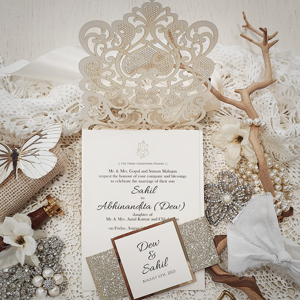 Invitation 8022: Ivory Shimmer, Gold Mirror, Cream Smooth - Ivory lasercut with glitter band and layered tag