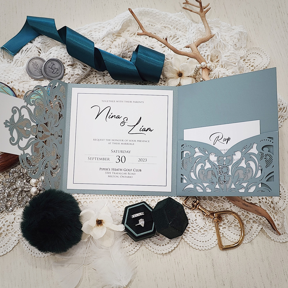 Invitation 8028: Dusty Blue Shimmer, Silver Mirror, Cream Smooth - Square dusky blue pocketfold lasercut with layered tag