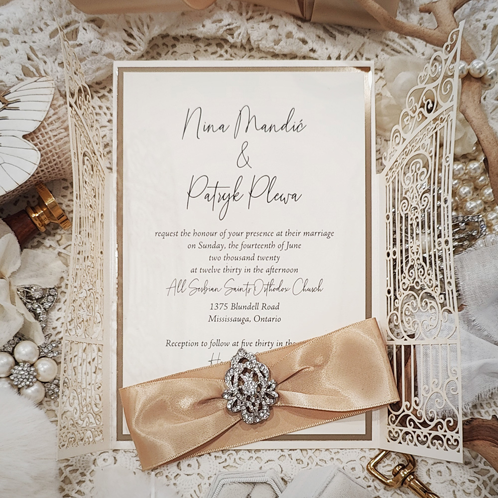 Invitation 8032: Ivory Shimmer, Gold Mirror, Cream Smooth, Champagne Ribbon, Brooch/Buckle A10 - ivory gate lasercut with ribbon and brooch and layered layout