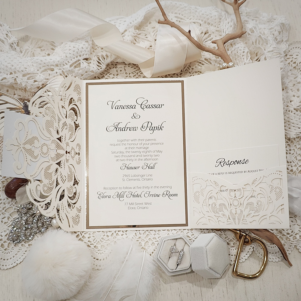 Invitation 8035: Ivory Shimmer, Gold Mirror, Cream Smooth - ivory pocketfold lasercut with layered layout and tag