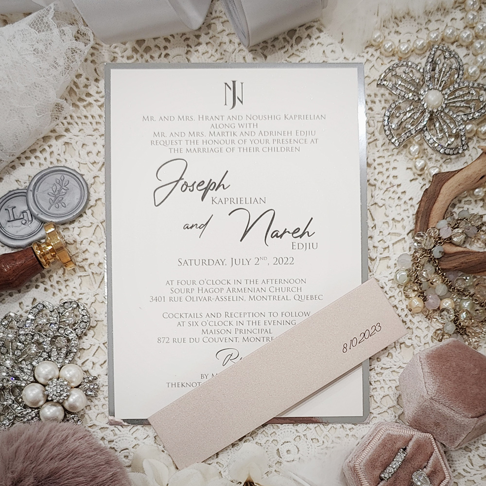 Invitation 5019:  - single panel invite with monogram and backed with silver mirror with blush pearl band