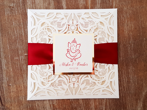 Invitation mb5: Ivory Shimmer, Gold Mirror, Cream Smooth, Sherry Ribbon - This is a popular square four flap laser cut design.  There is a sherry red ribbon wrapped around the invite and a layered cover tag.