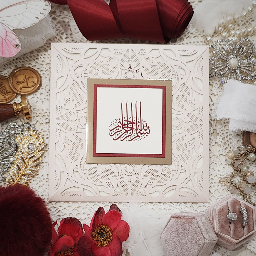 Invitation 8104: Ivory Shimmer, Red Lacquer, Cream Smooth - four flap lasercut with bismillah gold mirror and red lacquer border layered tag