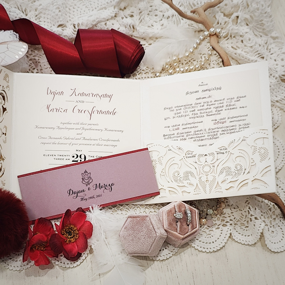 Invitation 8106: Ivory Shimmer, Red Lacquer, Cream Smooth - Pocketfolder lasercut ivory shimmer with layered vellum band with Ganesh