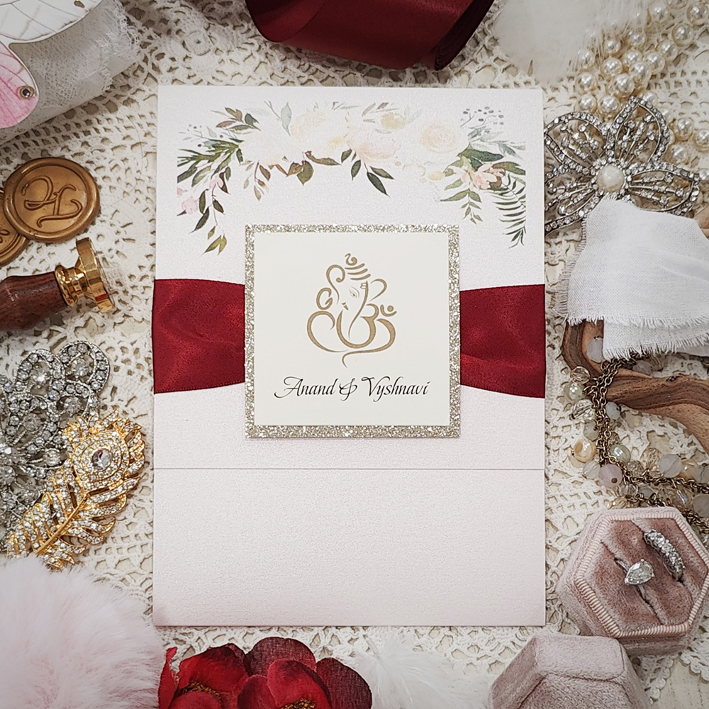 Invitation 8108: Light Pink Pearl, Champagne Glitter, Cream Smooth, Sherry Ribbon - Ganesh pocketfold in light pink pearl with sherry ribbon and layered glitter tag