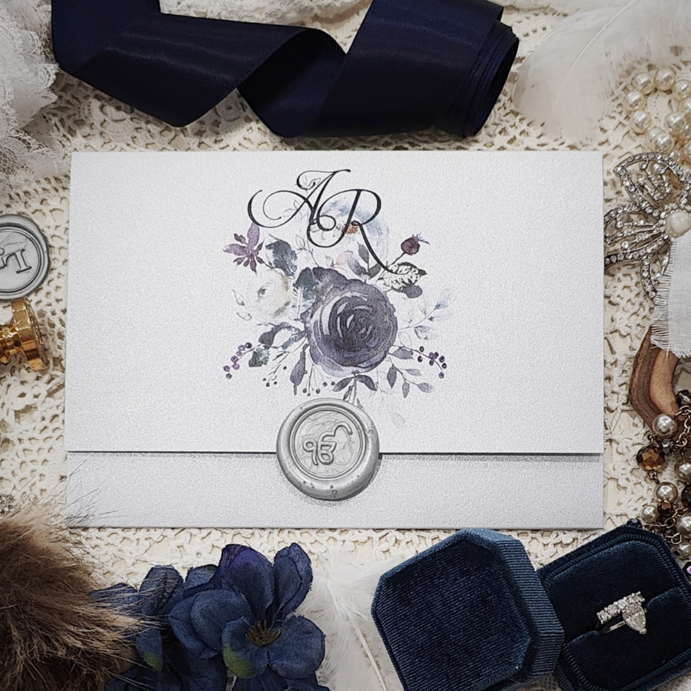 Invitation 8118: White Silver, Silver Wax - Silver pocketfold invite with silver ek onkar stamp and navy floral design