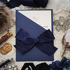 Invitation 3404: Navy Pearl, Cream Smooth, Navy Ribbon - Navy pocket style card with a loose cream insert.  A large 1.5 inch navy bow tied around.