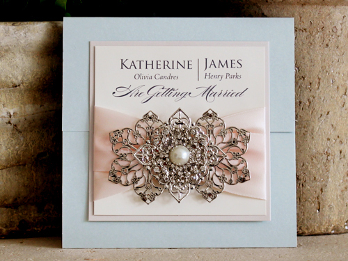 Invitation 1201: Light Blue Pearl, Iridescent Pearl - Trifold wedding invitation with a cover tag, ribbon and brooch combo.