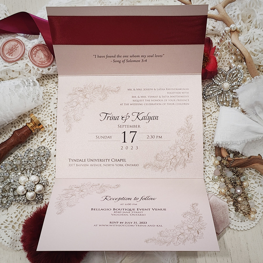 Invitation 3103: Rose Gold Pearl, Gold Wax, Sherry Ribbon - Landscape pocketfold wedding invitation opening vertically with a sherry ribbon and gold wax seal.