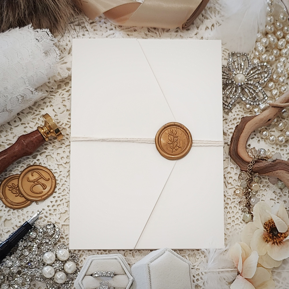 Invitation 3109: Antique Pearl, Gold Wax, String Ribbon - Pocketfold invitation with a pointy cover flap and a gold branch wax seal.