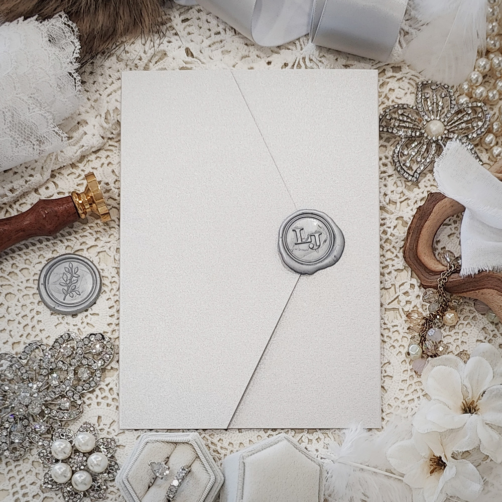 Invitation 3113: Silver Ore - Pocketfold wedding card on a silver ore paper with a silver wax seal.
