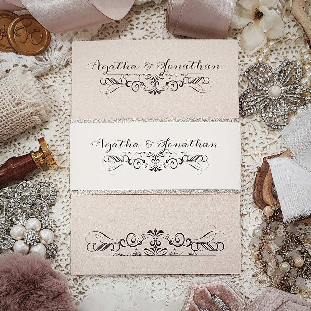 Invitation 3115: Blush Pearl, Champagne Glitter - Trifold pocketfolder wedding invite with a cream card stock belly band and champagne glitter backing.