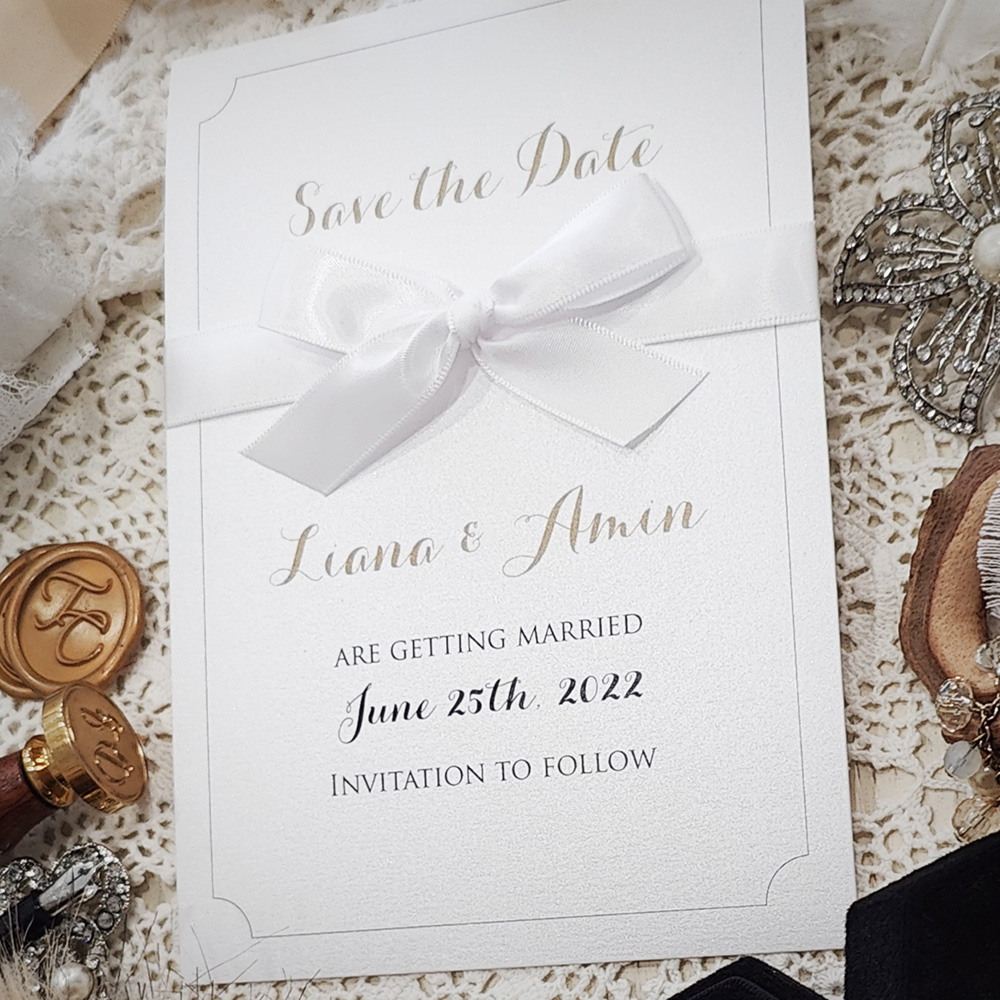 Invitation 8304:  - traditional save the date on cream matte paper with bow