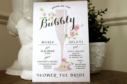 Invitation S37: Ivory Pearl - This is a champagne flute inspired bridal party invitation. There are floral elements on the card as well.