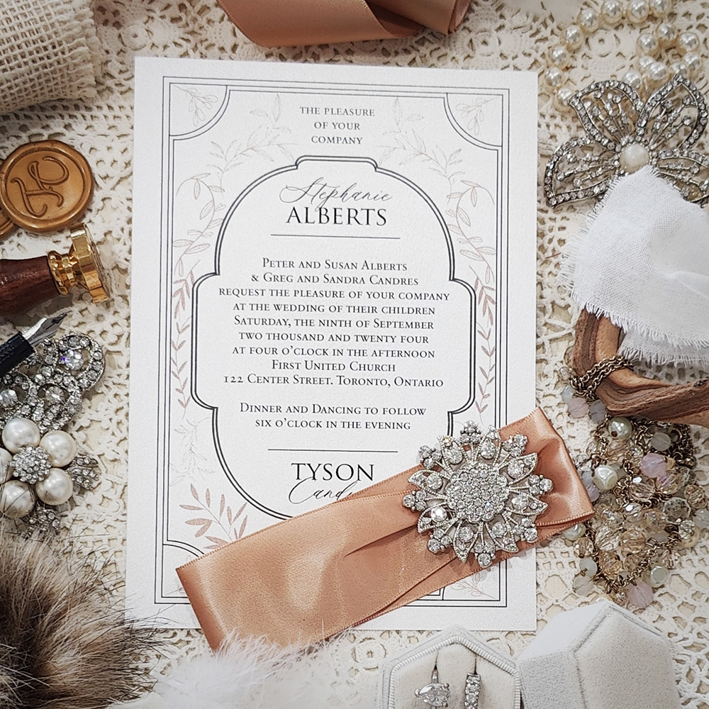 Invitation 3004: Ice Pearl, Pale Peach Ribbon, Brooch/Buckle A11 - Single card design with a printed border frame along with a ribbon and brooch embellishment.
