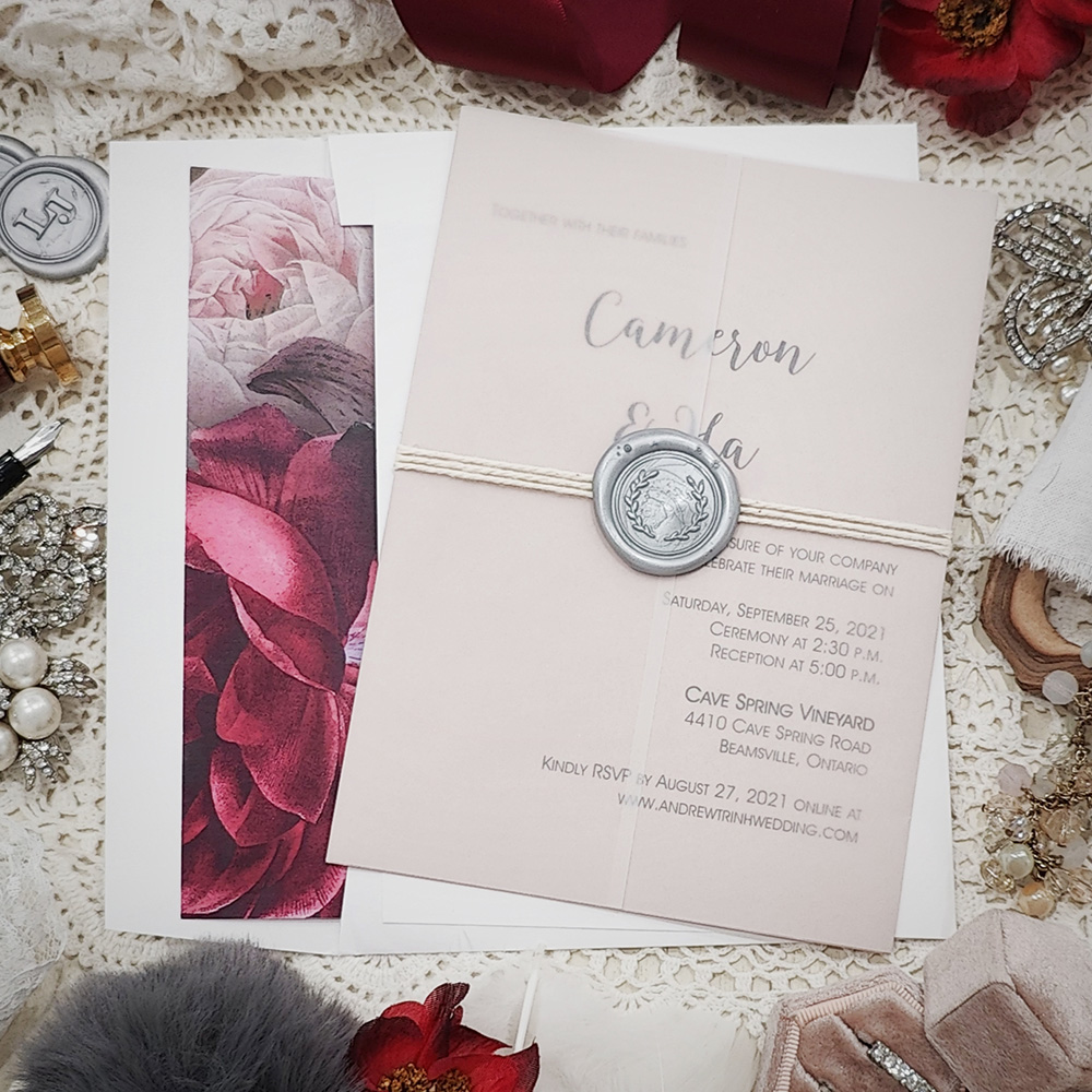 Invitation 3202: Blush Pearl, Silver Wax, String Ribbon - This is a blush pearl invite wrapped with a clear vellum wrap and finished with a string and silver wax seal combo.